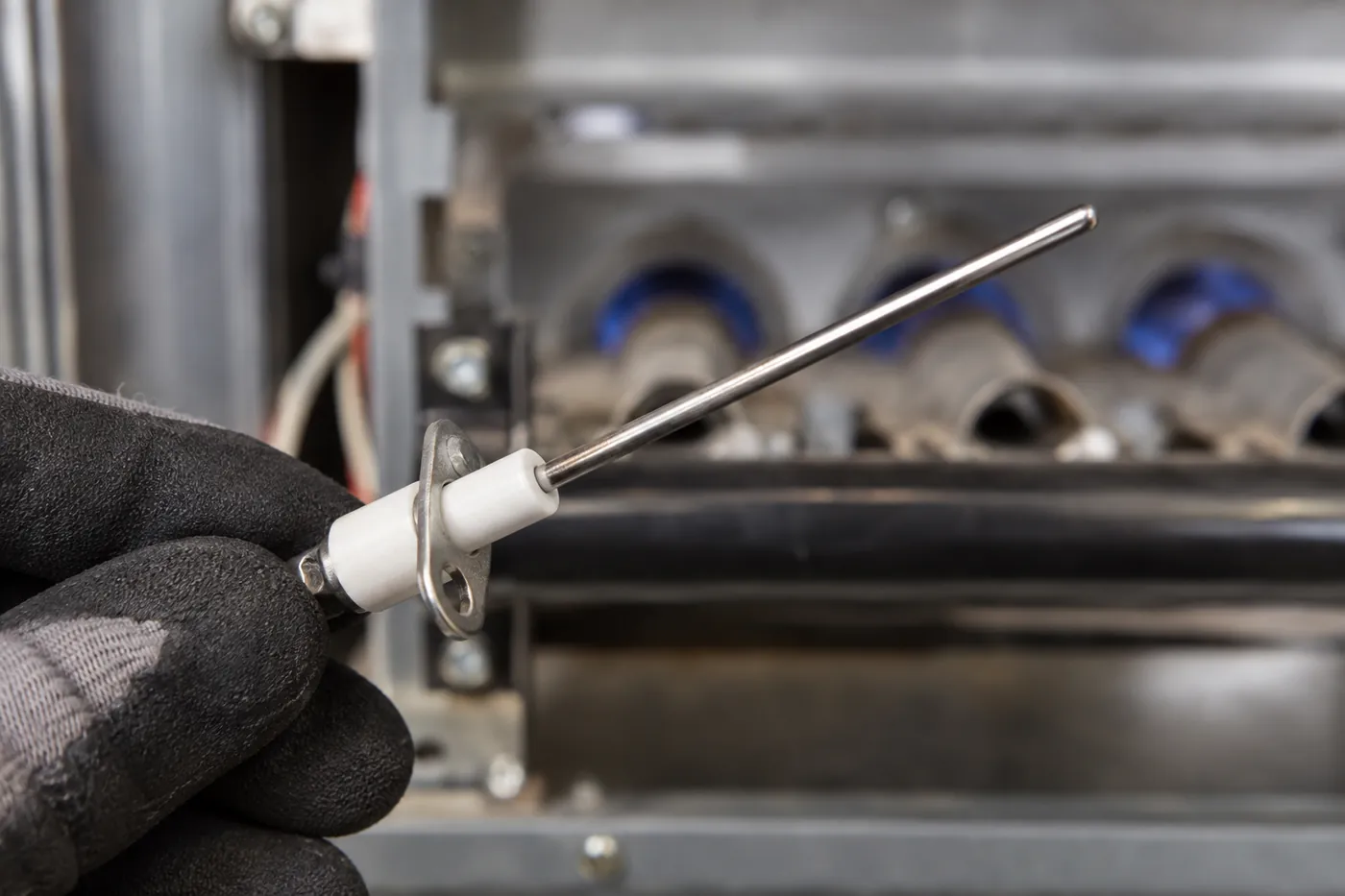 After: a furnace flame sensor, dirty vs. cleaned
