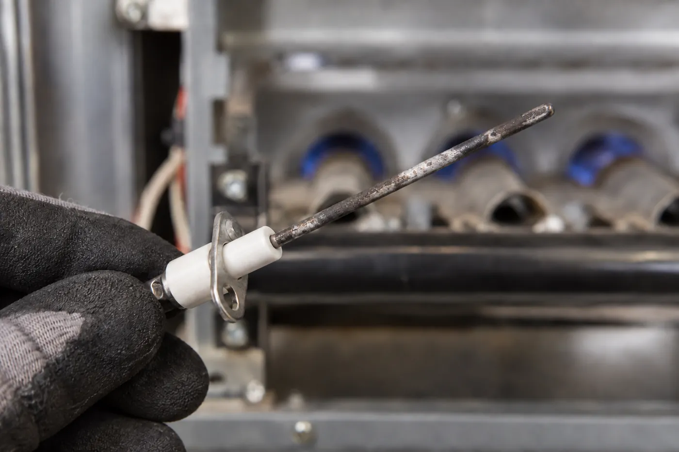 Before: a furnace flame sensor, dirty vs. cleaned