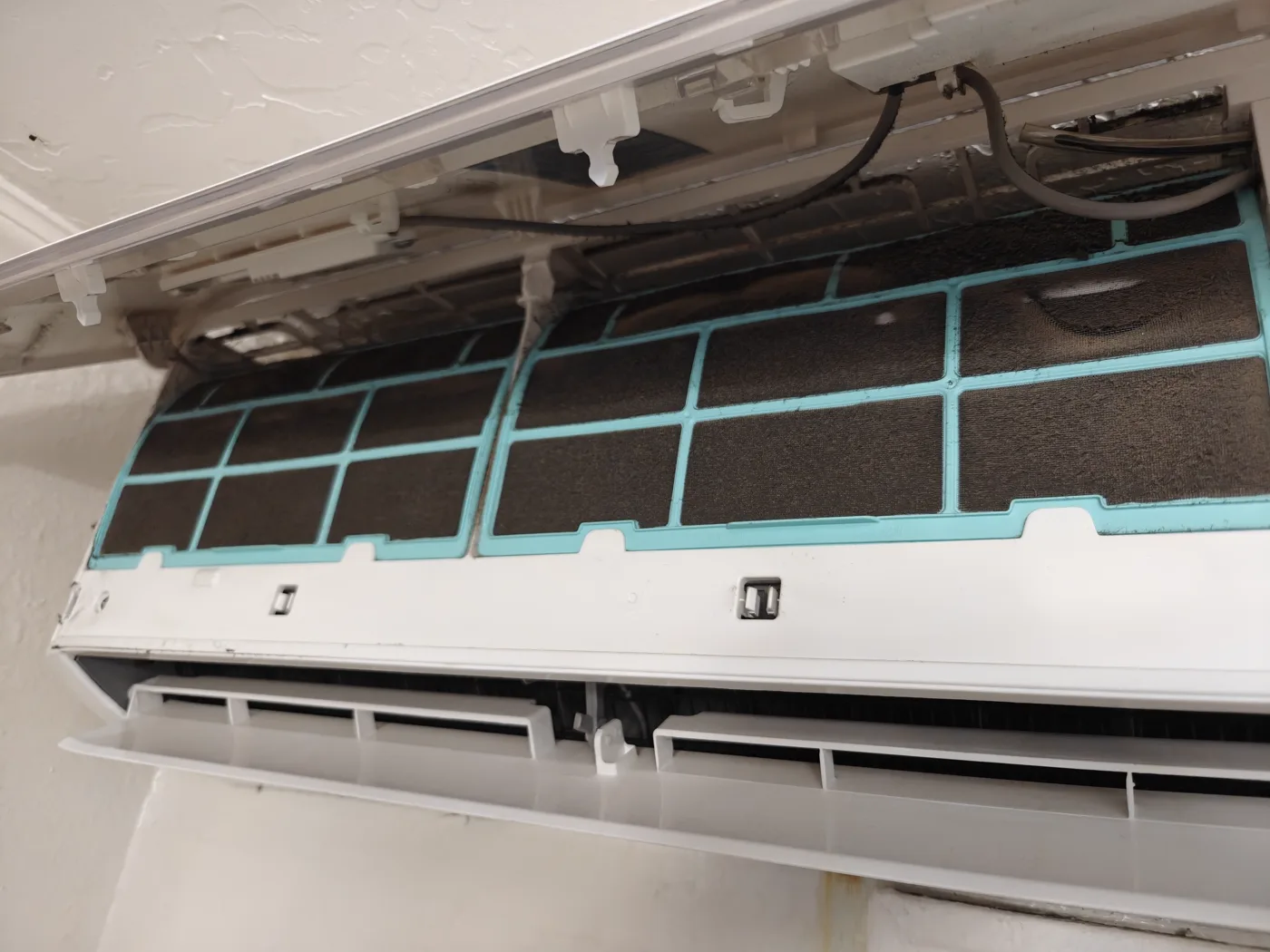 Ductless mini-split indoor unit opened for service