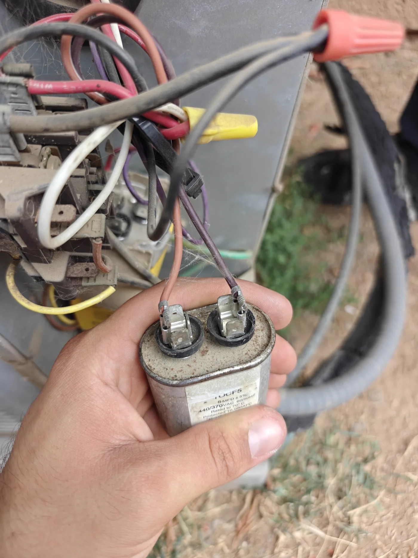 Testing a dual-run capacitor during an AC repair
